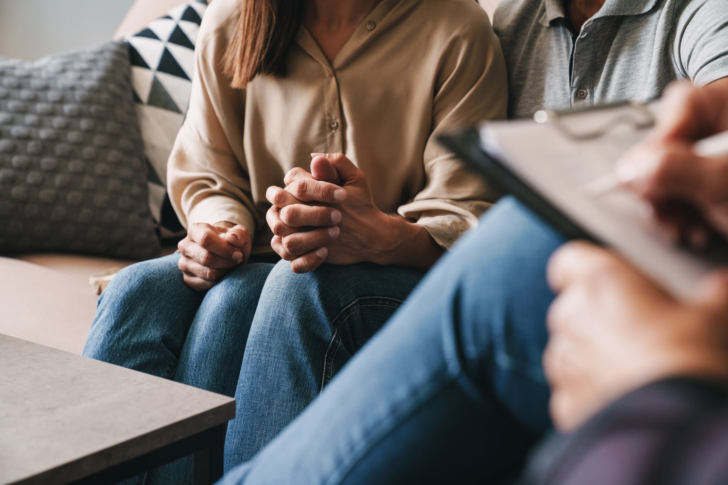 Close up of a couple sitting with their advisor